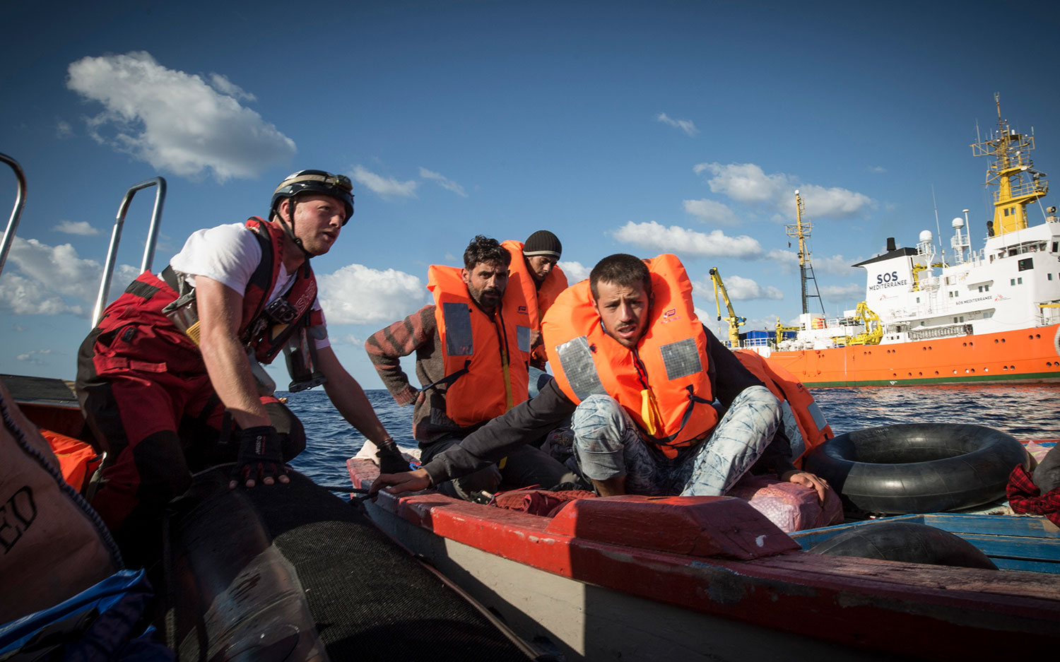 A young Syrian man who was traveling with his pregnant wife prepares to get on the SOS MEDITERRANEE speedboat for transfer to the Aquarius. October 10, 2017.